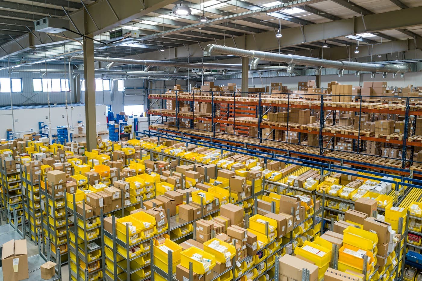 Organized warehouse racks and cartons for order consolidation